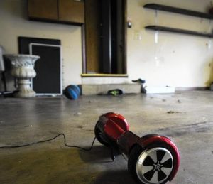 A hoverboard purchased by Doris Yadav for her two sons sits in the family's garage in Frankfor while it charges on Jan. 16, 2016. She insists the hoverboard stay in the garage while charging in case it catches fire. (Armando L. Sanchez / Chicago Tribune)